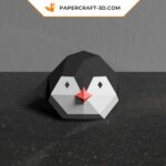 Papercraft of baby penguin sliding in 3D origami