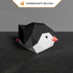 Papercraft of baby penguin sliding in 3D origami