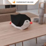 Papercraft of baby penguin sliding in 3D origami