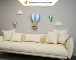 Papercraft balloons and clouds in a sky in 3D origami