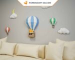 Papercraft balloons and clouds in a sky in 3D origami