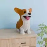 Papercraft de bébé Corgi assis mignon en origami 3D