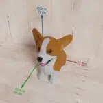 Papercraft de bébé Corgi assis mignon en origami 3D