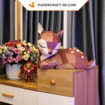 Papercraft fawn on rock in origami