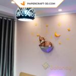 Papercraft fawn on rock in origami