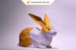 Papercraft de coelho deitado em origami 3D