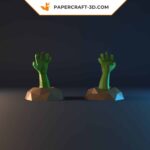 Papercraft of a hand emerging from the ground in 3D origami