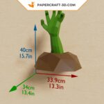 Papercraft of a hand emerging from the ground in 3D origami