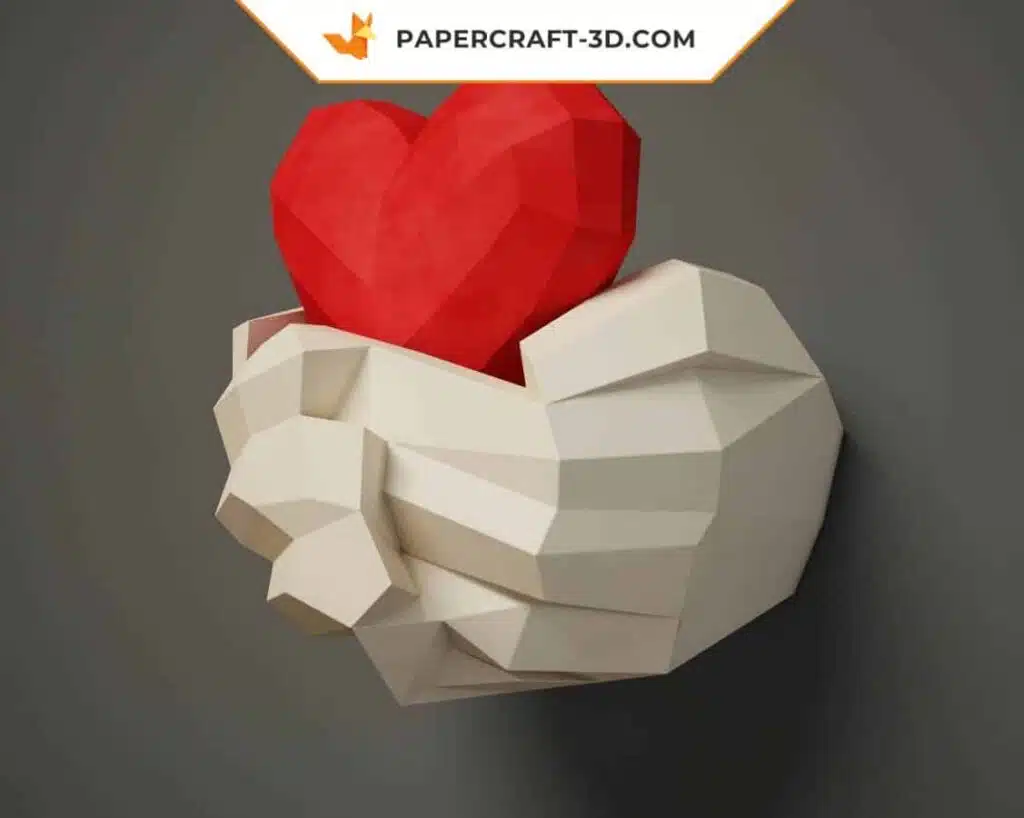 Papercraft mains tenant un cœur en origami