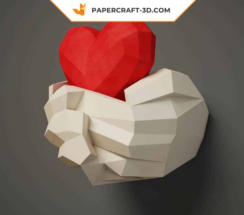 Papercraft mãos segurando um coração em origami