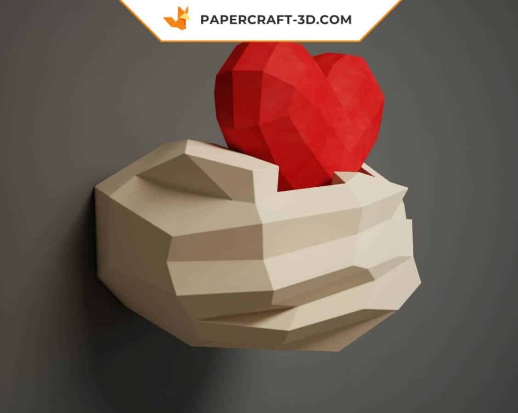 Papercraft hands holding an origami heart