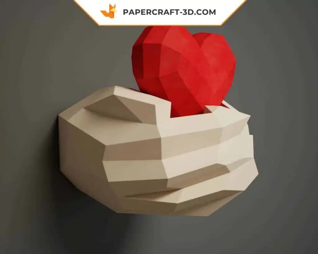 Papercraft mains tenant un cœur en origami