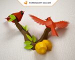 Papercraft birds on branch in origami