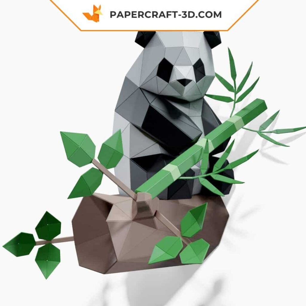 Papercraft panda sentado no bambu em origami