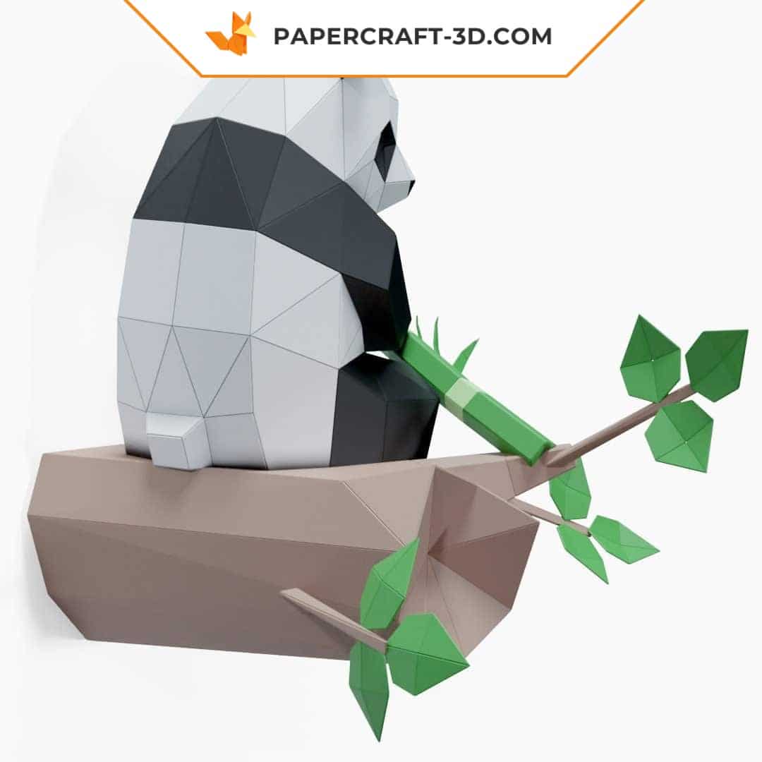 Papercraft panda sitting on bamboo in 3D origami
