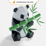 Papercraft panda mangeant du bambou en origami