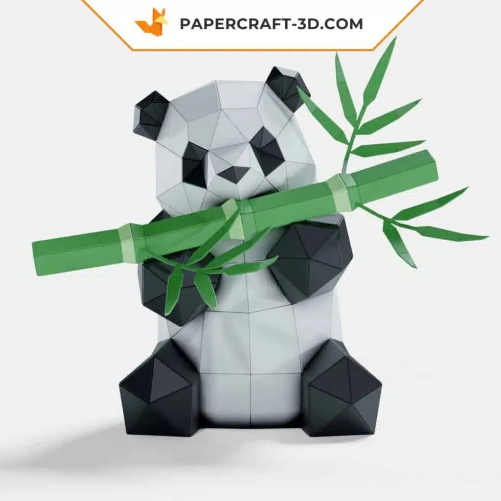 Papercraft panda comiendo bambú en origami
