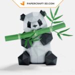 Papercraft panda mangeant du bambou en origami