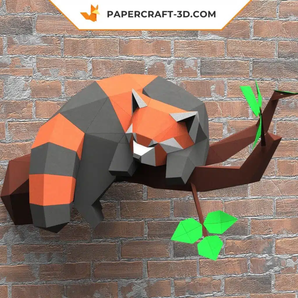 Papercraft schlafender Roter Panda auf einem Ast als 3D-Origami