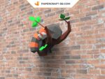 Papercraft panda rouge endormi sur une branche en origami 3D