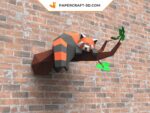 Papercraft panda rouge endormi sur une branche en origami 3D