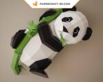 Papercraft panda on bamboo in 3D origami