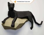 Papercraft black panther on a rock in 3D origami
