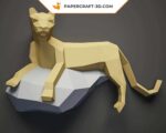 Papercraft black panther on a rock in 3D origami