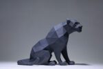 Papercraft black panther sitting in 3D origami