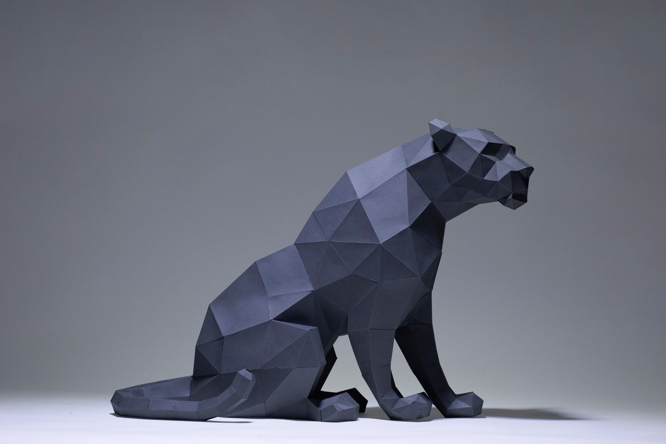 Papercraft black panther sitting in 3D origami Papercraft black panther sitting in 3D origami