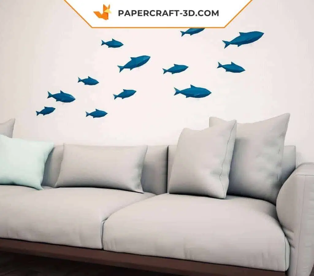 Papercraft-Schwarm blauer Wandfische im Origami-Stil