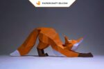 Papercraft fox stretching in 3D origami