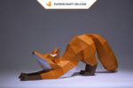 Papercraft fox stretching in 3D origami