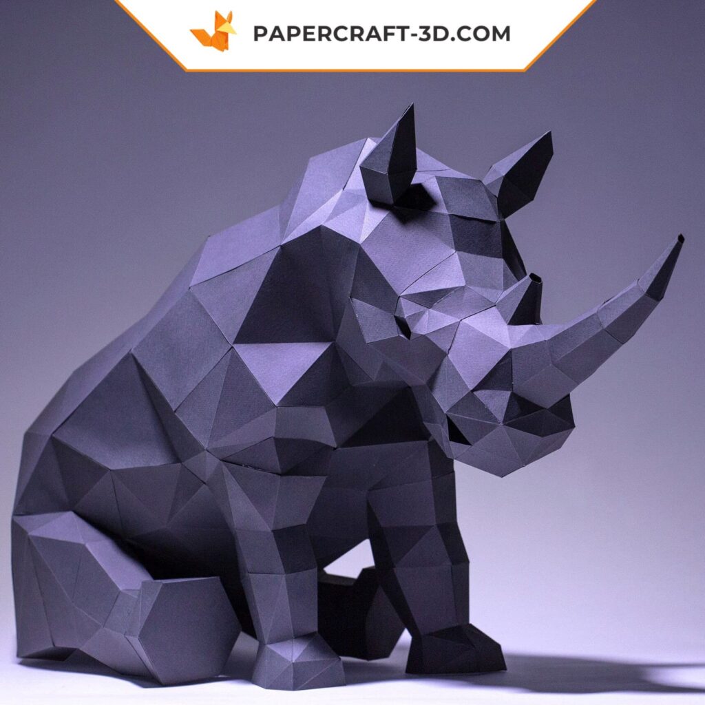 Papercraft of a sitting rhinoceros in 3D origami