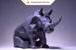 Papercraft di rinoceronte seduto in origami 3D