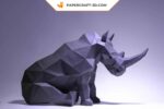 Papercraft di rinoceronte seduto in origami 3D