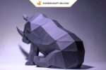 Papercraft di rinoceronte seduto in origami 3D