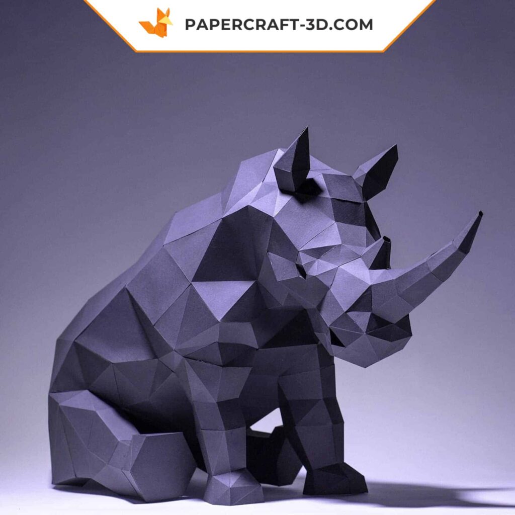 Papercraft of a sitting rhinoceros in 3D origami
