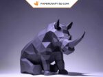 Papercraft di rinoceronte seduto in origami 3D