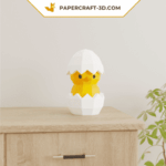 Papercraft poussin dans un œuf en origami 3D