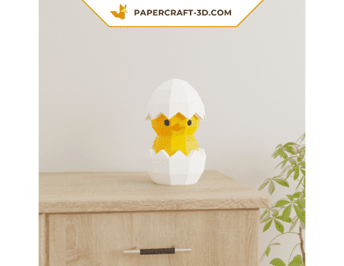 Papercraft chick in an egg in 3D origami