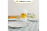 Papercraft pintinho em um ovo em origami 3D
