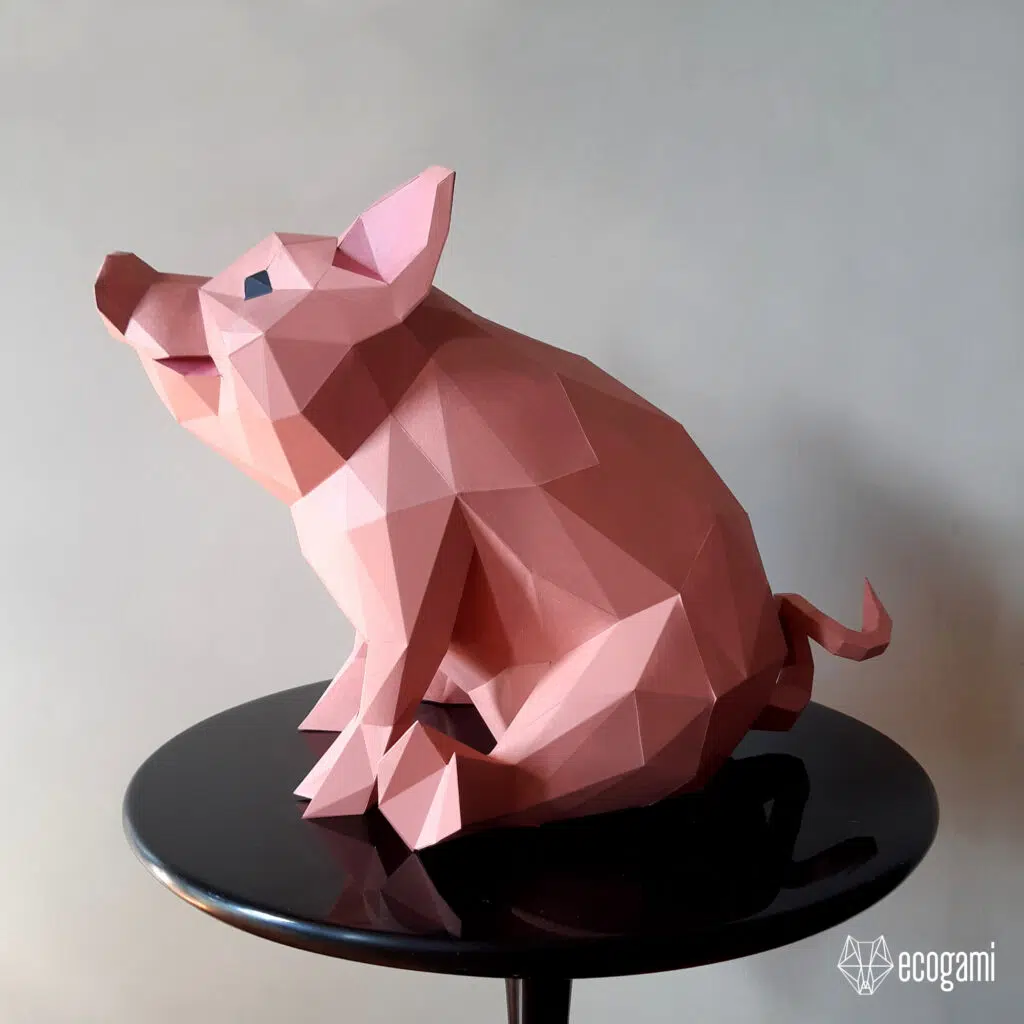 Papercraft di maiale seduto in origami 3D