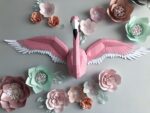 Papercraft flamingo wall with wings in 3D origami