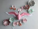 Papercraft flamingo wall with wings in 3D origami