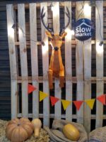 Papercraft deer emerging from wall in 3D origami