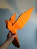 Papercraft de pássaros voando em origami 3D