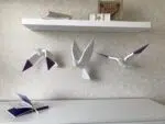Papercraft de pássaros voando em origami 3D