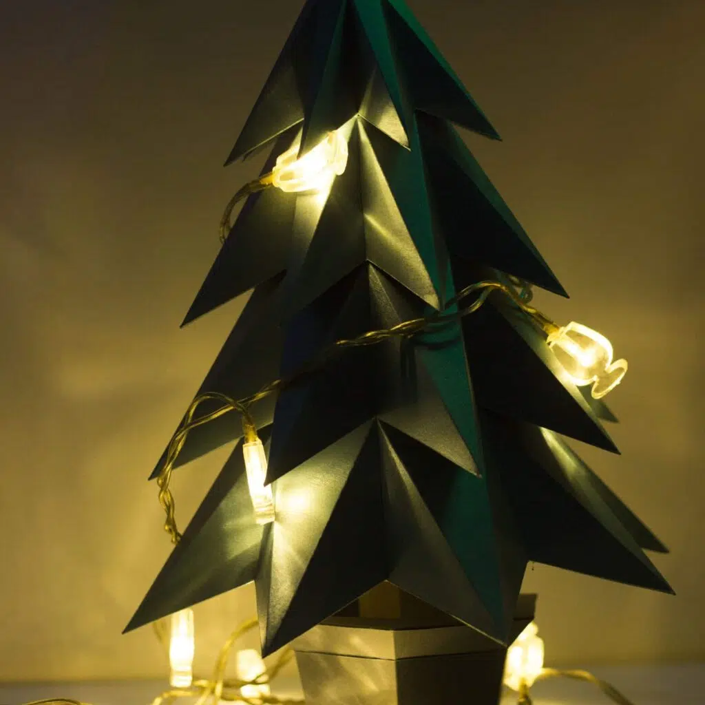 Papercraft Christmas tree in a pot in 3D origami
