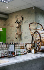 Papercraft deer emerging from wall in 3D origami